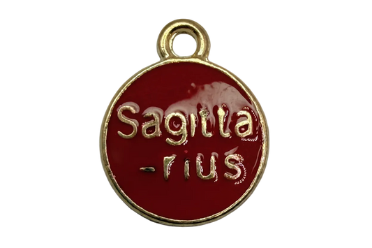 Round deep-red enamel Sagittarius coin with raised gold lettering and gold rim