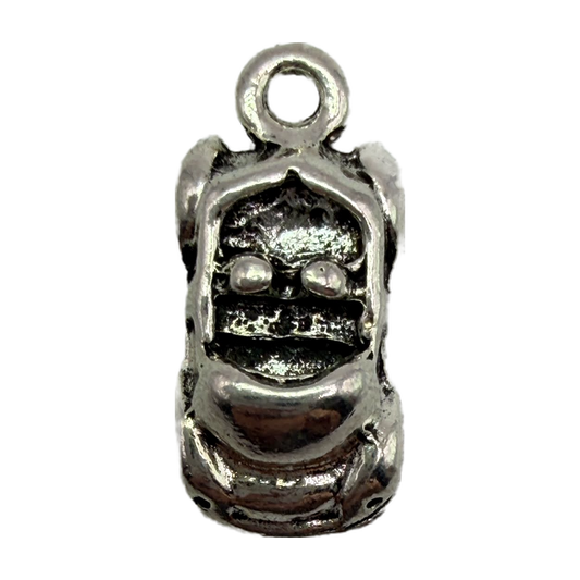 Oxidized silver-tone gorilla face charm with carved eyes and dark recessed detailing