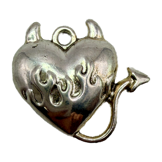 Silver devil heart charm with horns, flame details, and arrow-tipped tail