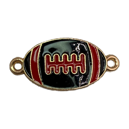 Black enamel football with red stripes and gold detailing