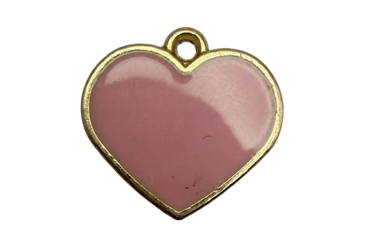 Glossy blush-pink enamel heart with gold trim on a black background