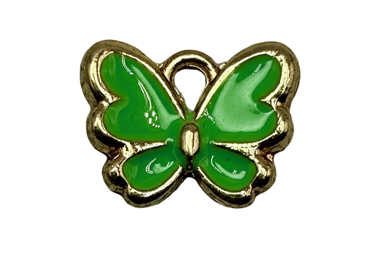 Glossy green enamel butterfly with gold outline on black background