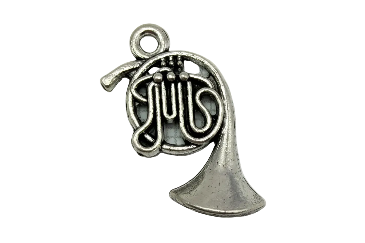 Antiqued silver French horn with coiled tubing, valve details, and a flared bell