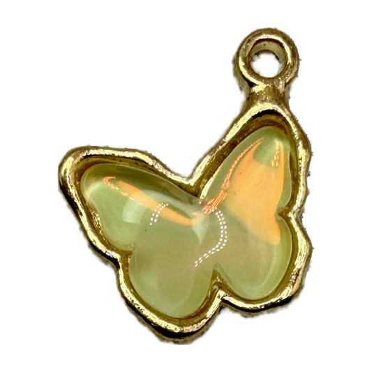 Opalescent pale green butterfly charm with glossy finish and gold outline