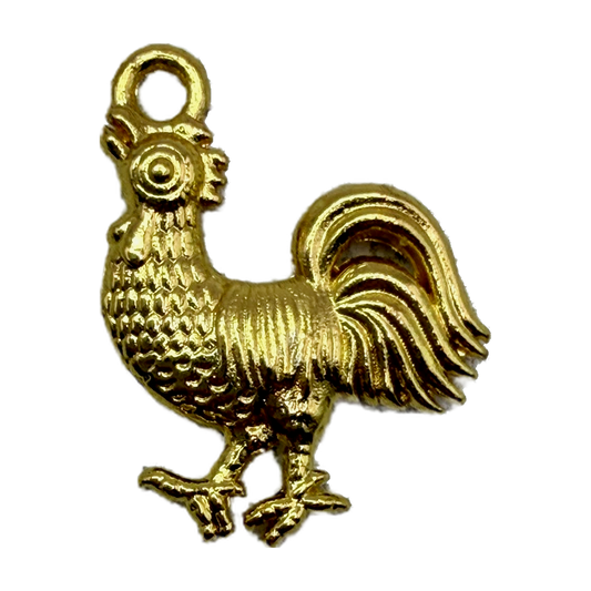 Glossy gold rooster pendant with textured feather details on black background