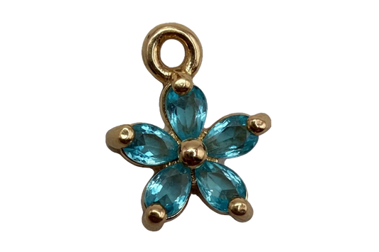 Gold flower charm with five faceted aqua blue petal gems