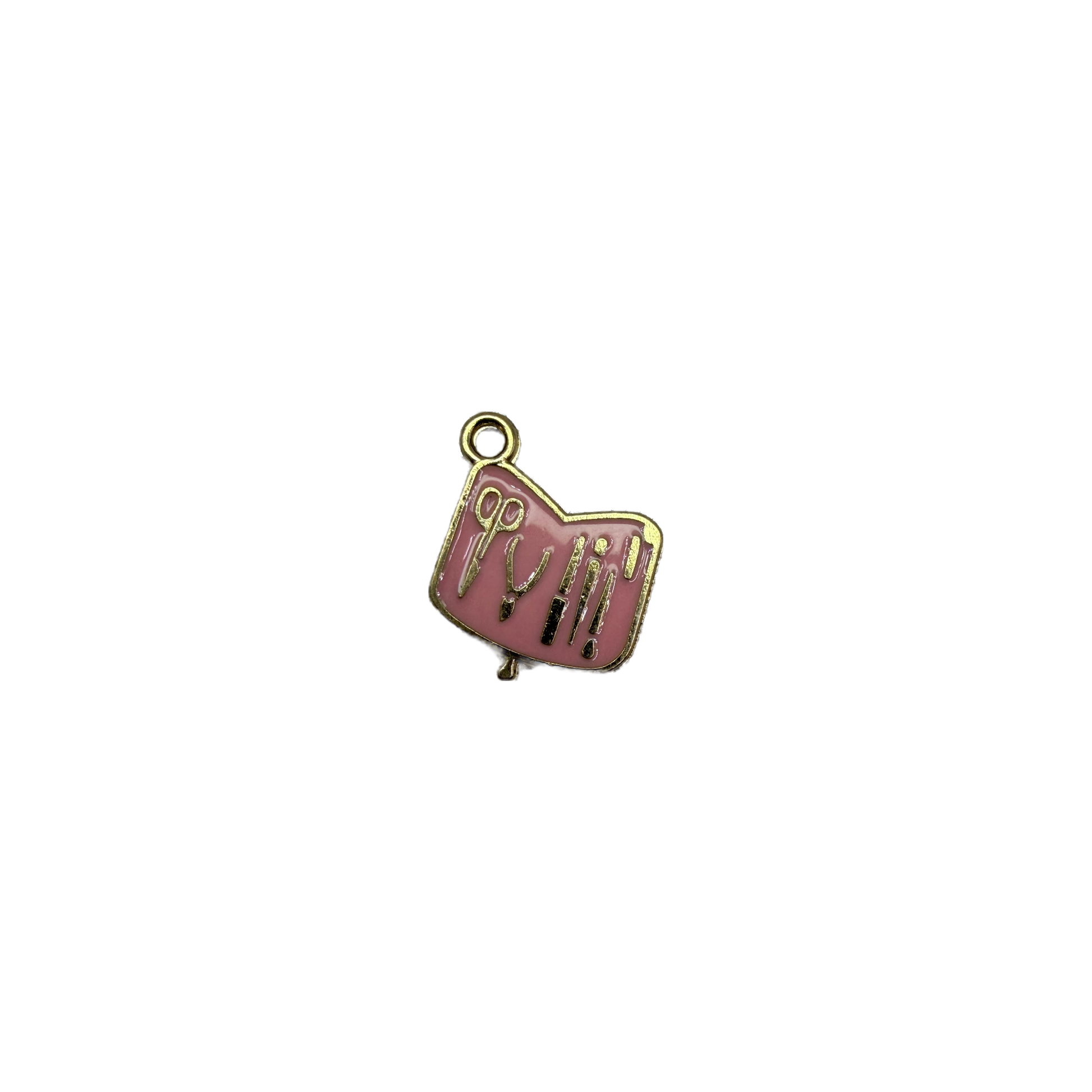 Pink enamel plaque with gold scissors and beauty tools