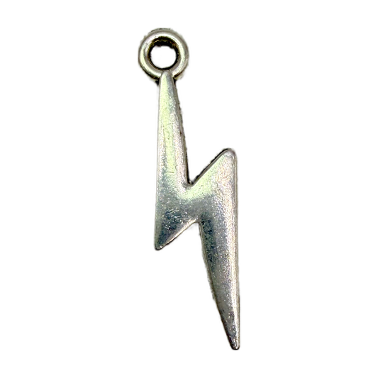 Polished silver lightning bolt charm pendant on black background