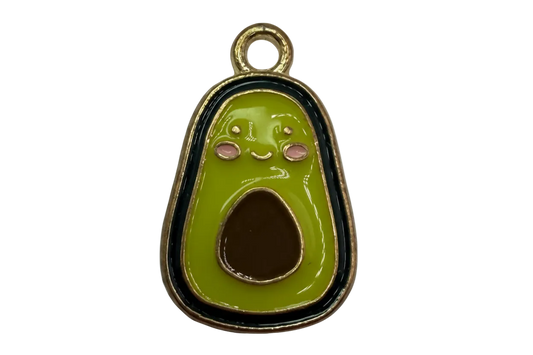 Smiling avocado half in glossy green enamel with brown pit, pink cheeks, and gold outline