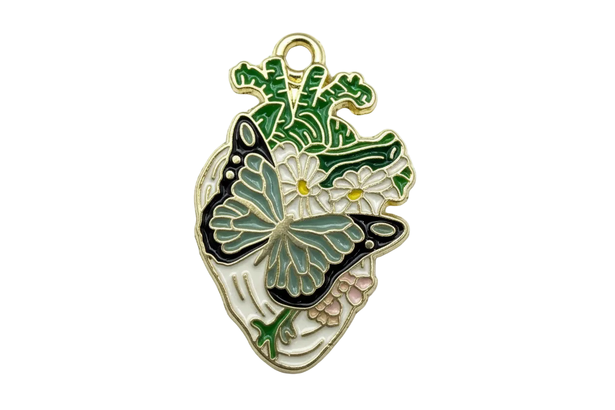 Gold enamel anatomical heart with black and teal butterfly, white daisies, and green leaves