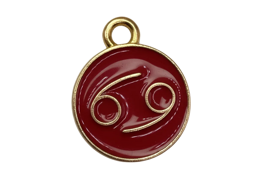 Crimson enamel Cancer zodiac medallion with raised gold symbol