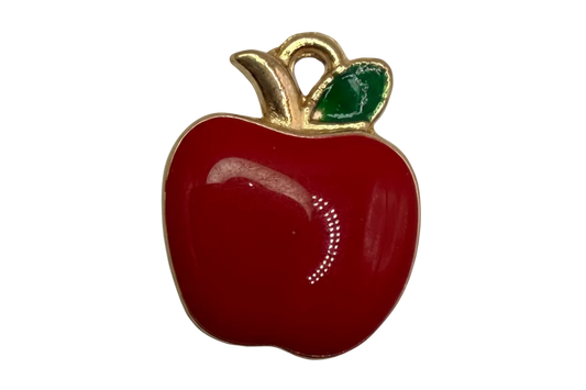 Glossy red apple fruit with green leaf and gold outline on black background