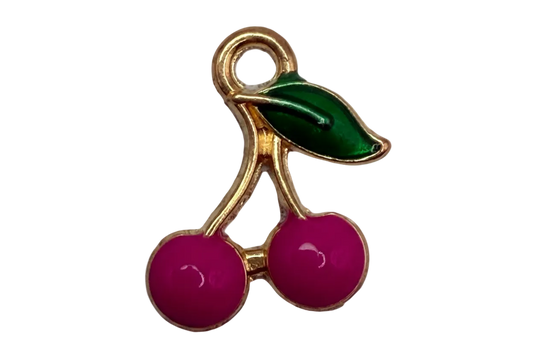 Gold cherry cluster with glossy fuchsia enamel cherries and a dark green leaf