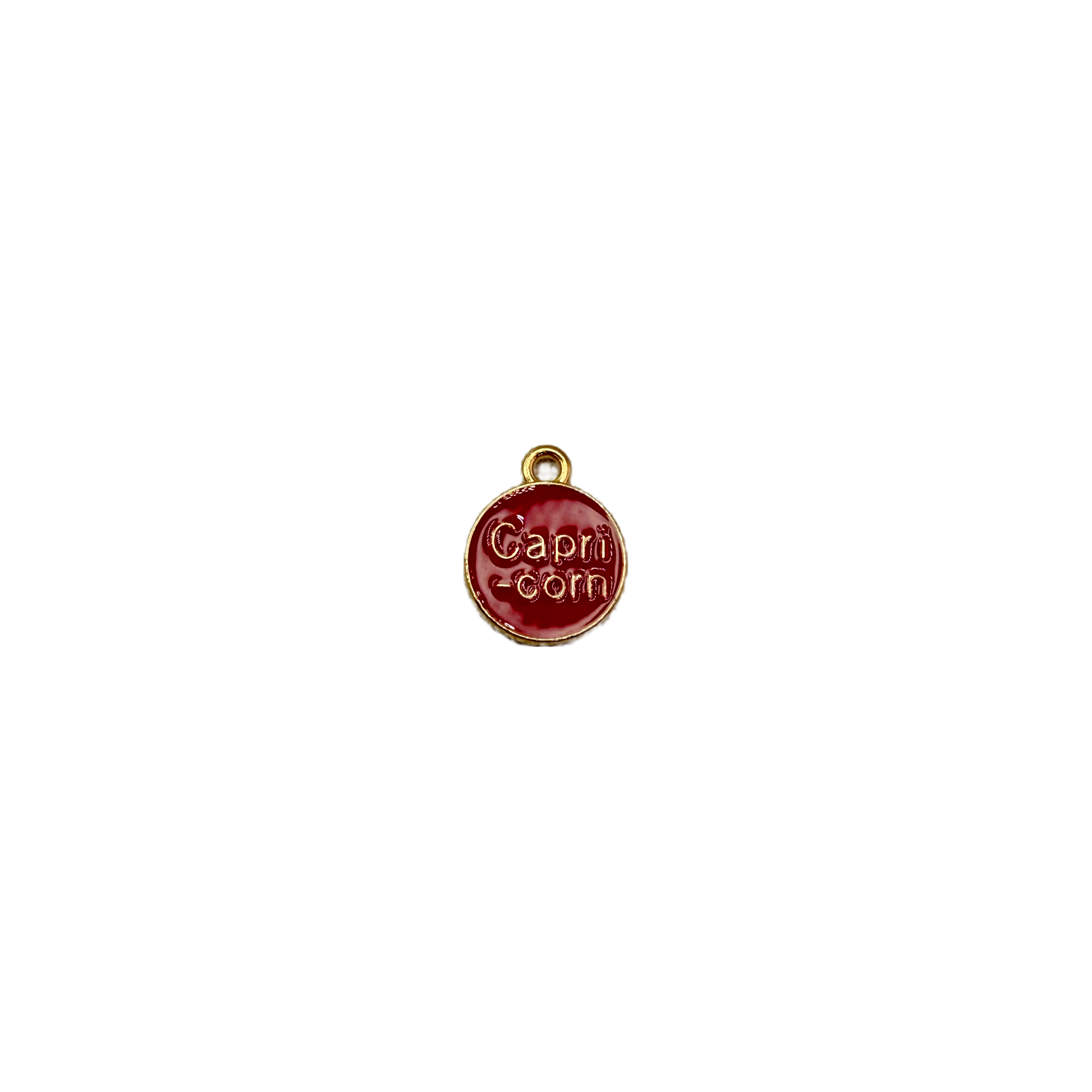 Red enamel Capricorn coin with raised gold lettering
