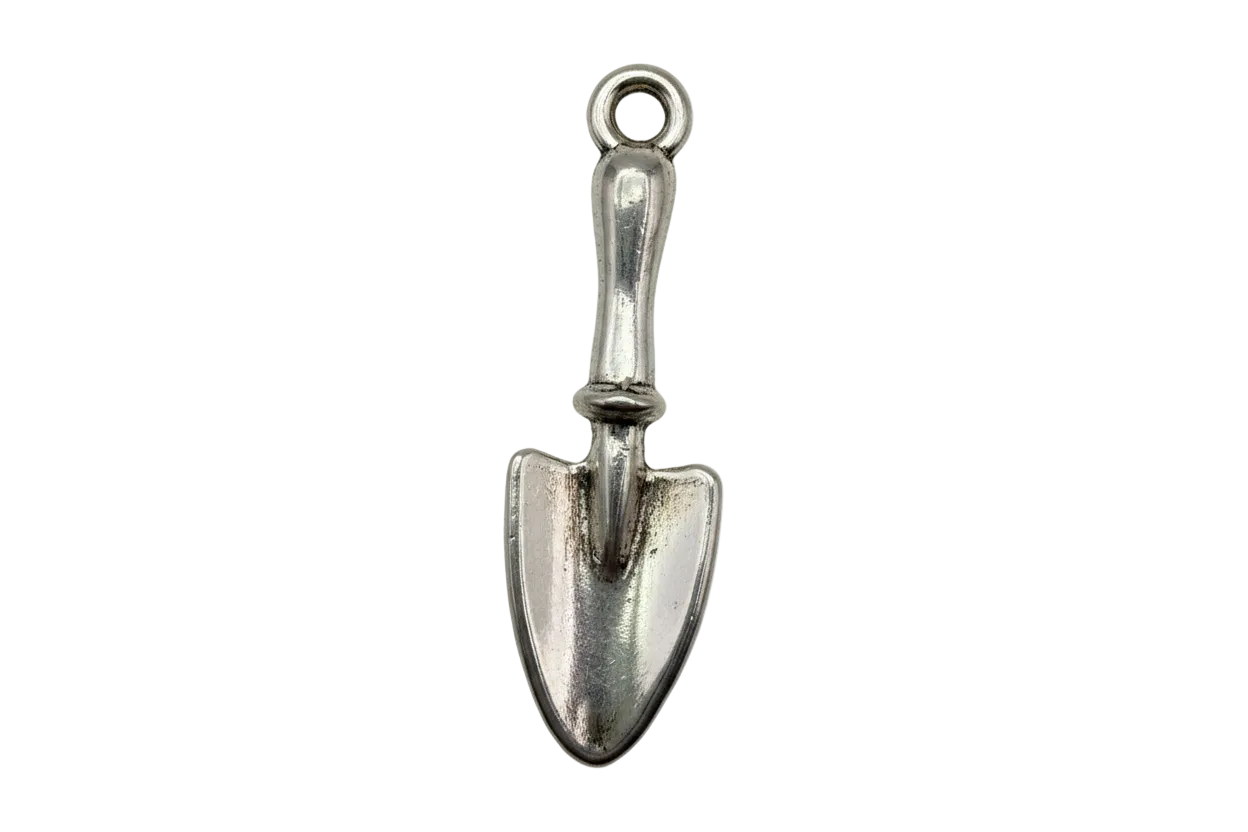 Polished silver garden trowel charm with subtle aged patina on black background