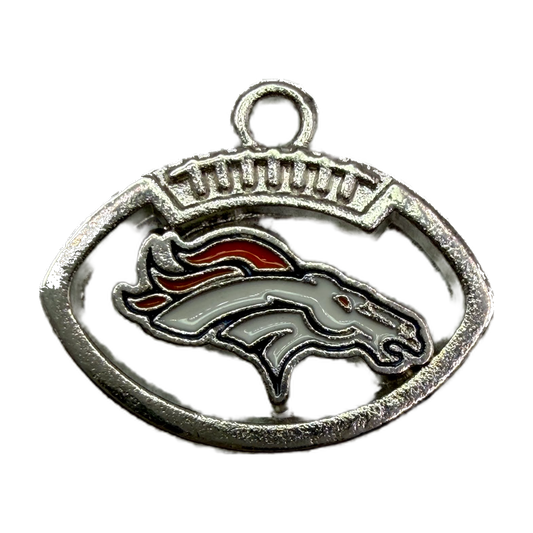 Silver oval horse head emblem with white enamel, orange mane, and arched lettering detail