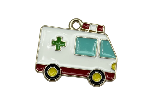 Glossy enamel ambulance van with green cross, red stripe, aqua windows, and gold outline