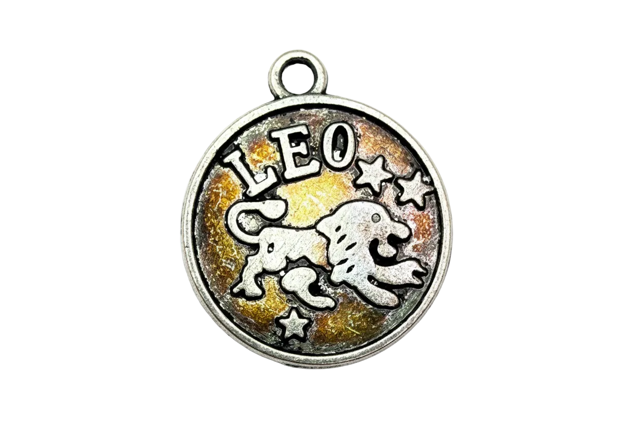 Antiqued silver round Leo zodiac medallion with raised lion and stars on amber enamel