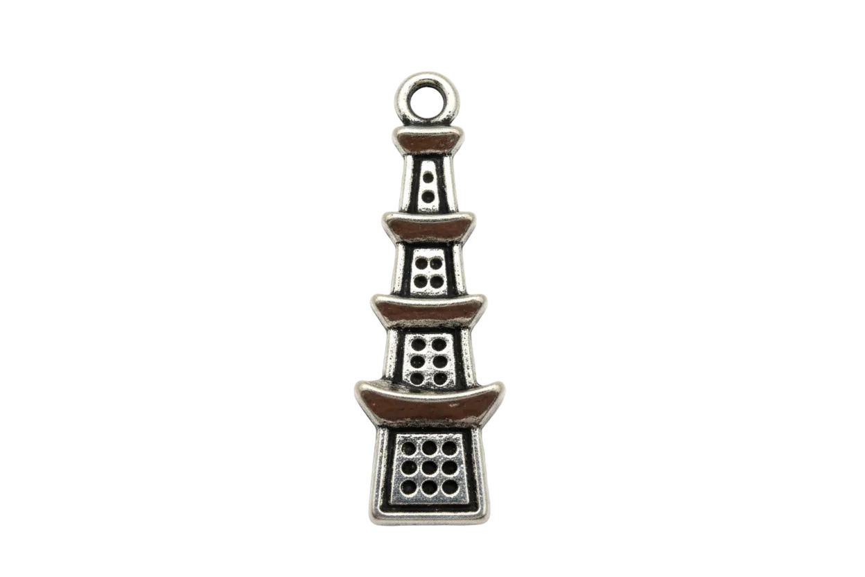 Antiqued silver pagoda tower charm with tiered roofs and cutout window details on a black background