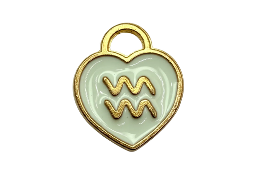 White enamel heart with gold Aquarius symbol and marbled neutral accent in gold-tone frame