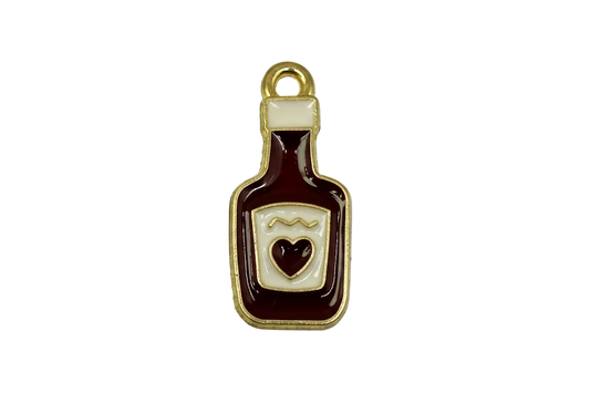 Gold-trimmed burgundy bottle charm with ivory label and small heart detail