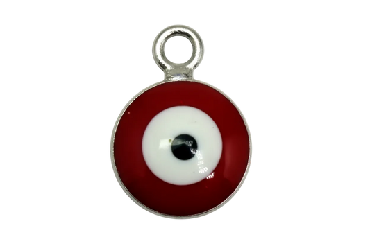 Glossy red and white evil eye disc with black center in silver-tone frame
