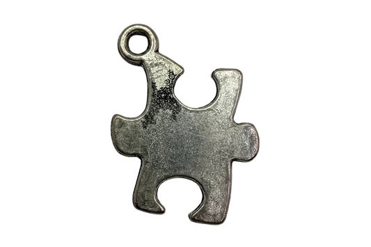 Antique silver jigsaw puzzle piece charm with brushed matte finish