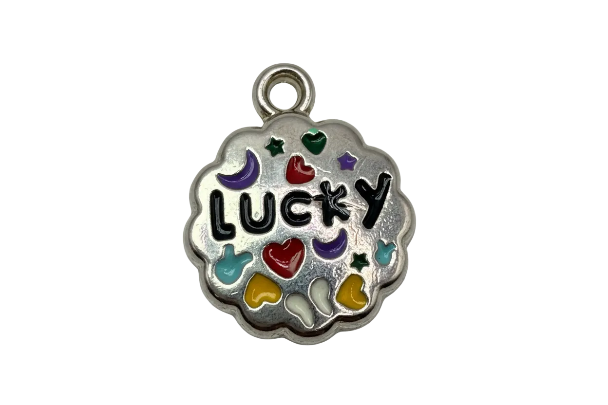Silver-tone scalloped coin charm with black "LUCKY" lettering and colorful enamel hearts, stars, and moons
