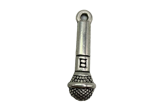 Oxidized silver-toned microphone charm with textured grille and ridged handle