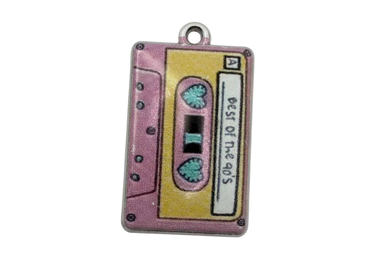 Pink and yellow cassette tape enamel charm with teal heart reels and gold finish