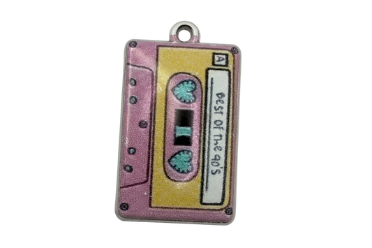 Pink and yellow cassette tape enamel charm with teal heart reels and gold finish
