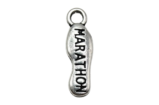 Silver engraved tag with darkened “MARATHON” lettering