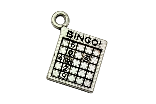 Silver bingo game card charm with black grid and raised "BINGO" lettering