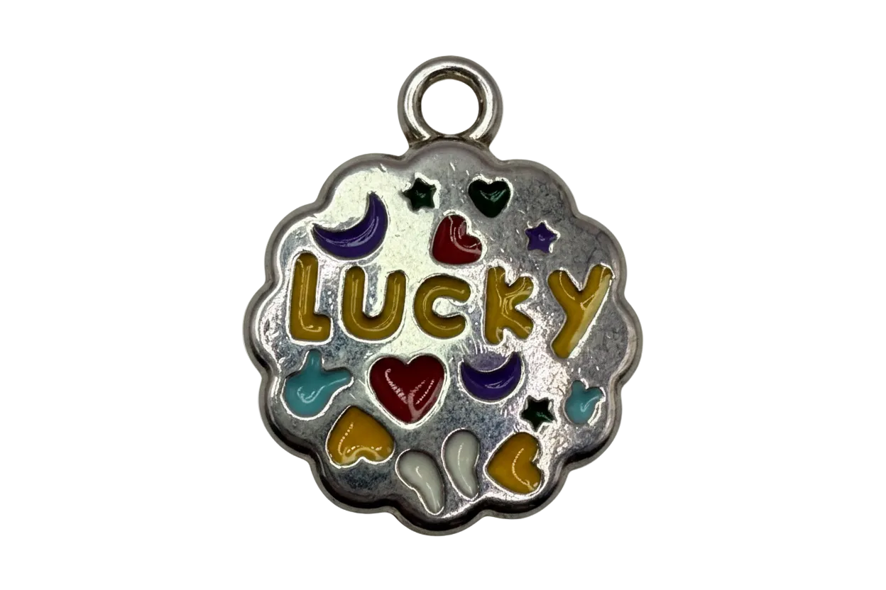 Scalloped silver medallion with gold LUCKY lettering and multicolor enamel hearts, moons, stars, and hands