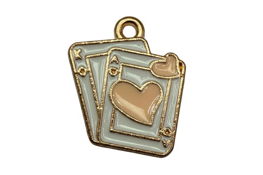 Gold-outlined enamel playing card stack with a blush heart on pale gray cards