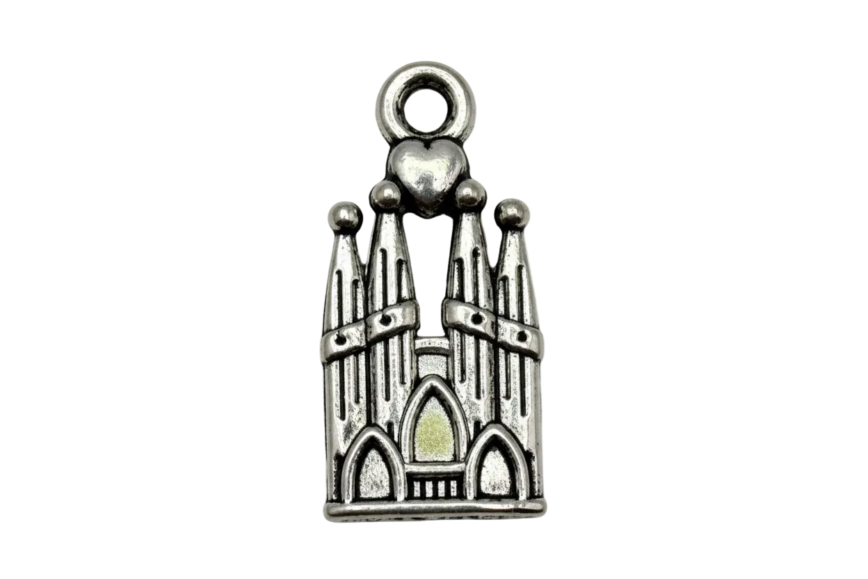 Antique silver cathedral facade charm with arched windows, spires, and small heart detail