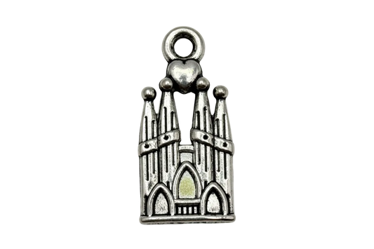 Antique silver cathedral facade charm with arched windows, spires, and small heart detail