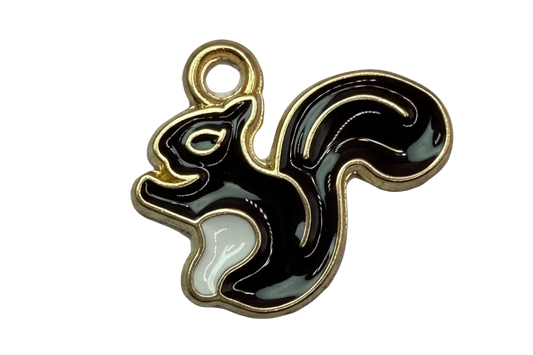 Glossy black and white squirrel silhouette with gold outline