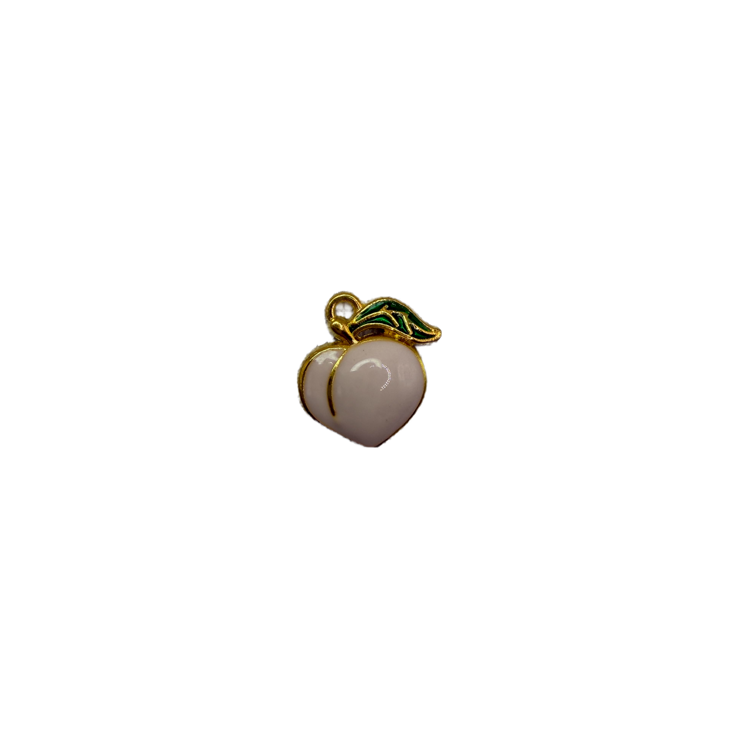 White peach fruit in gold with green leaf