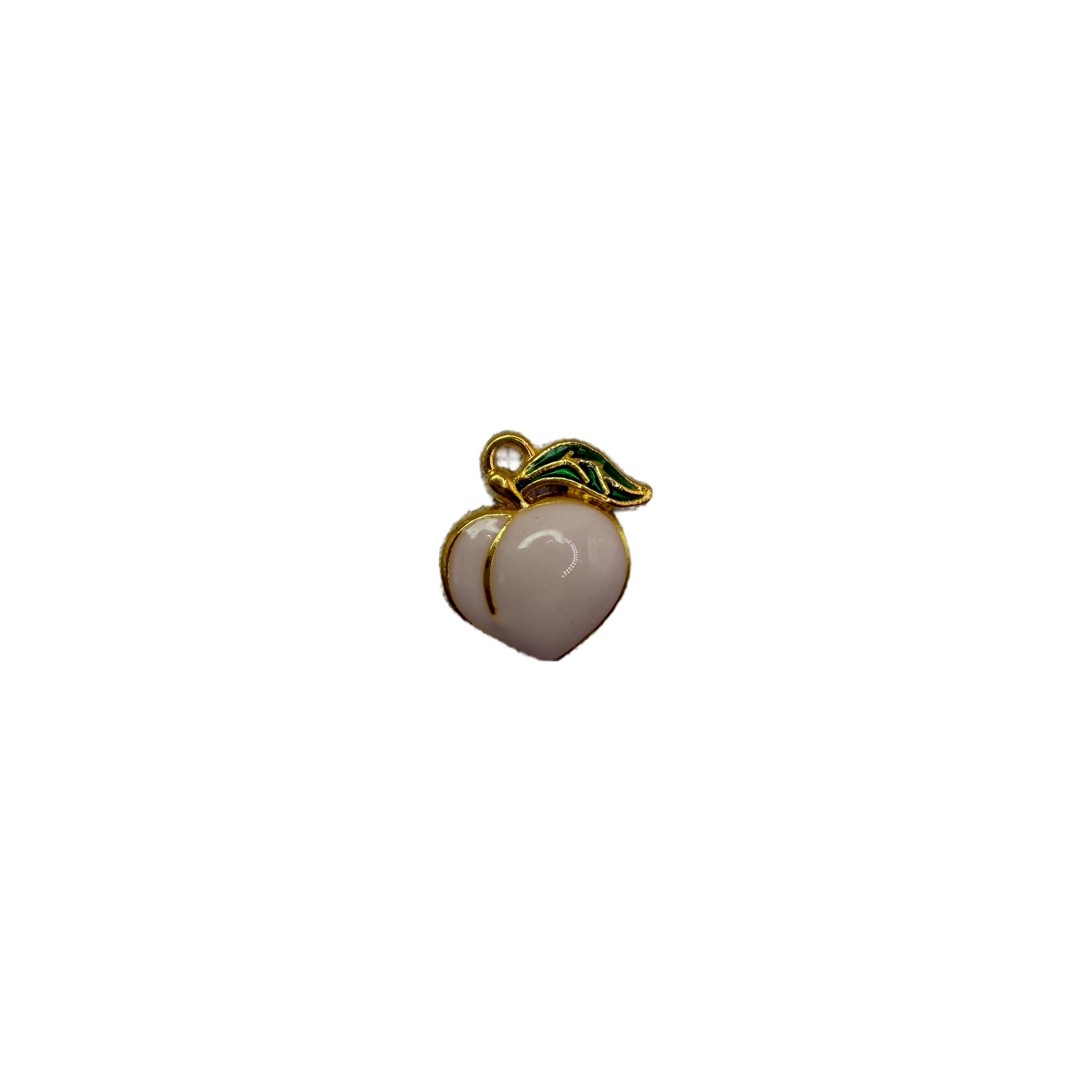 White peach fruit in gold with green leaf