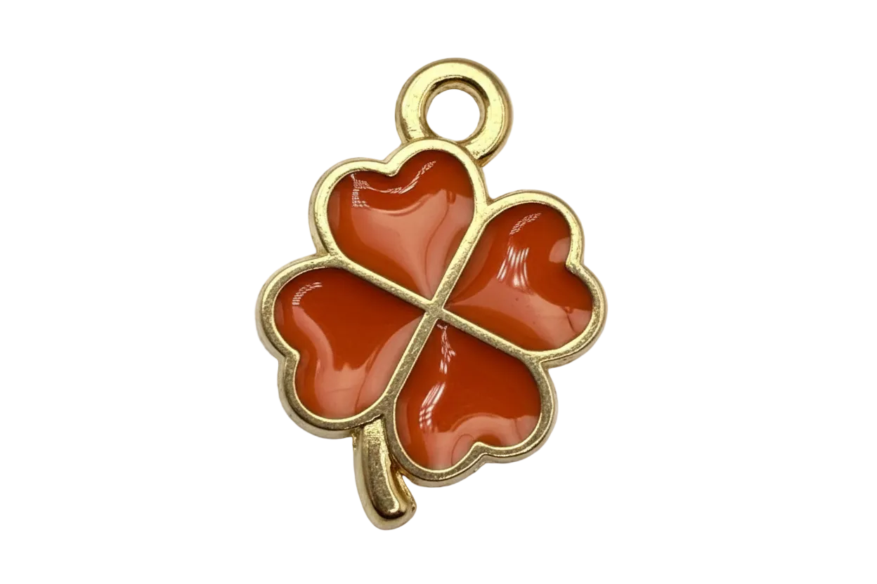 Gold four-leaf clover charm with glossy orange heart-shaped petals