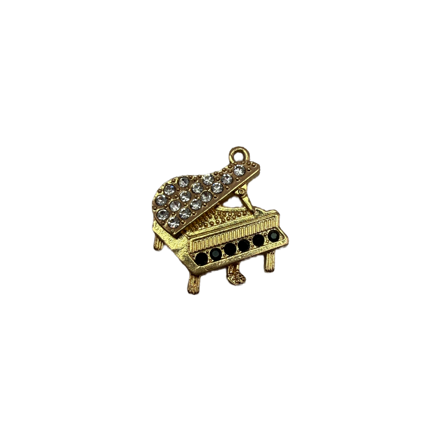 Gold grand piano with clear crystals and black gems
