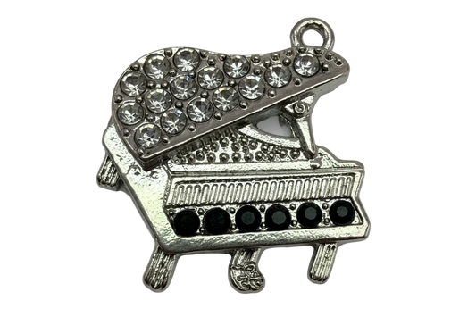 Silver grand piano with pavé clear crystals on the lid and black stone accents