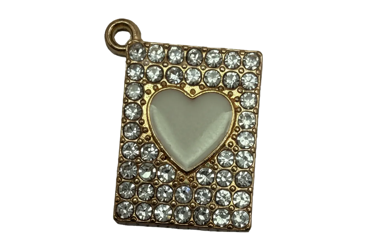 Gold rectangle plaque with pavé clear crystals and an ivory heart center