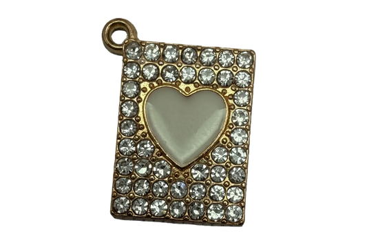 Gold rectangle plaque with pavé clear crystals and an ivory heart center