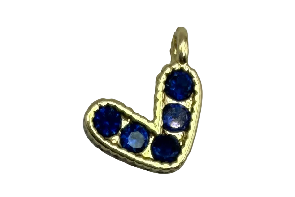 Gold initial J charm with five sapphire-blue round gems in a curved letter silhouette