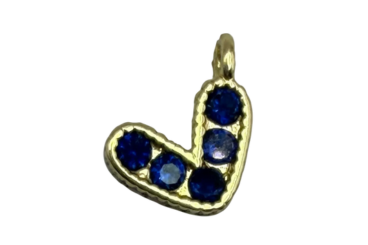 Gold initial J charm with five sapphire-blue round gems in a curved letter silhouette