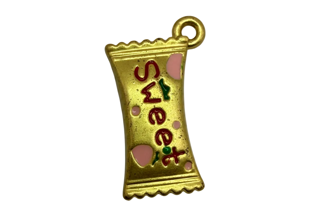 Gold candy wrapper charm with red and green “sweet” lettering and pink heart enamel accents