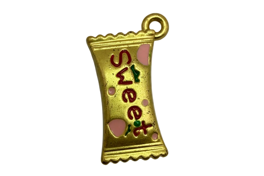 Gold candy wrapper charm with red and green “sweet” lettering and pink heart enamel accents