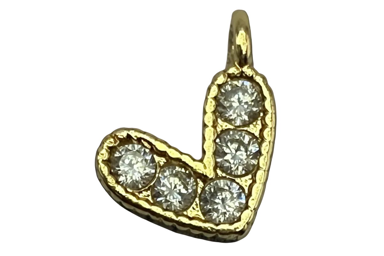 Gold letter J initial with clear pavé gems on a black background